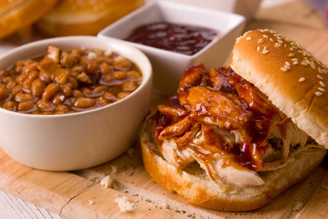 Barbecue beans and a shredded pork sandwich.