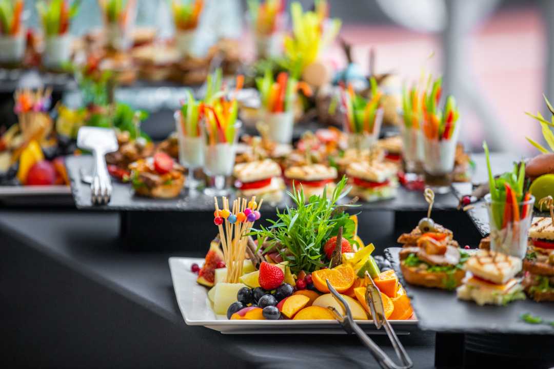 Serving plates of food at a dining function.